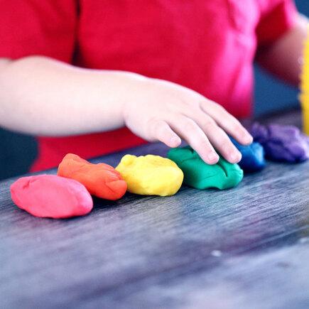Kid Making Clay Figures